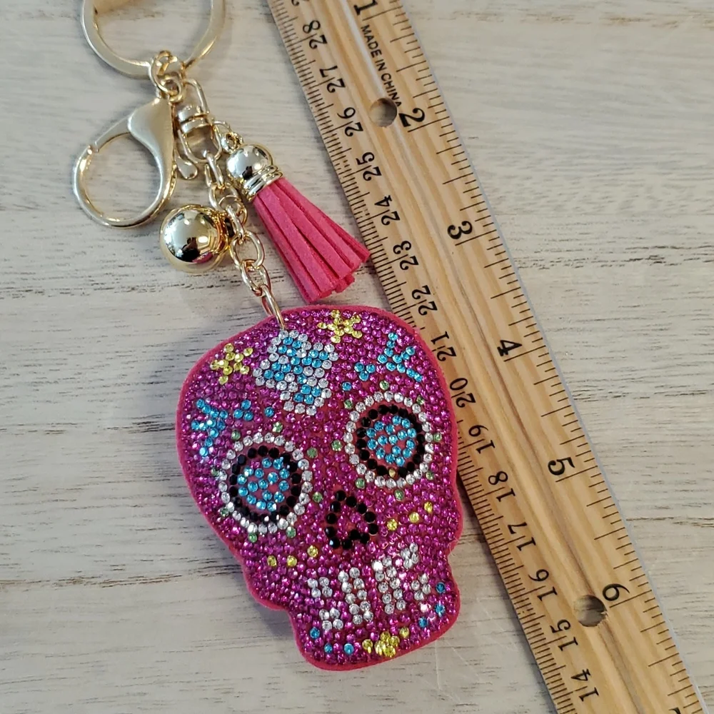 Pink sugar skull puffy keychain multicolored rhinestones ball tassel